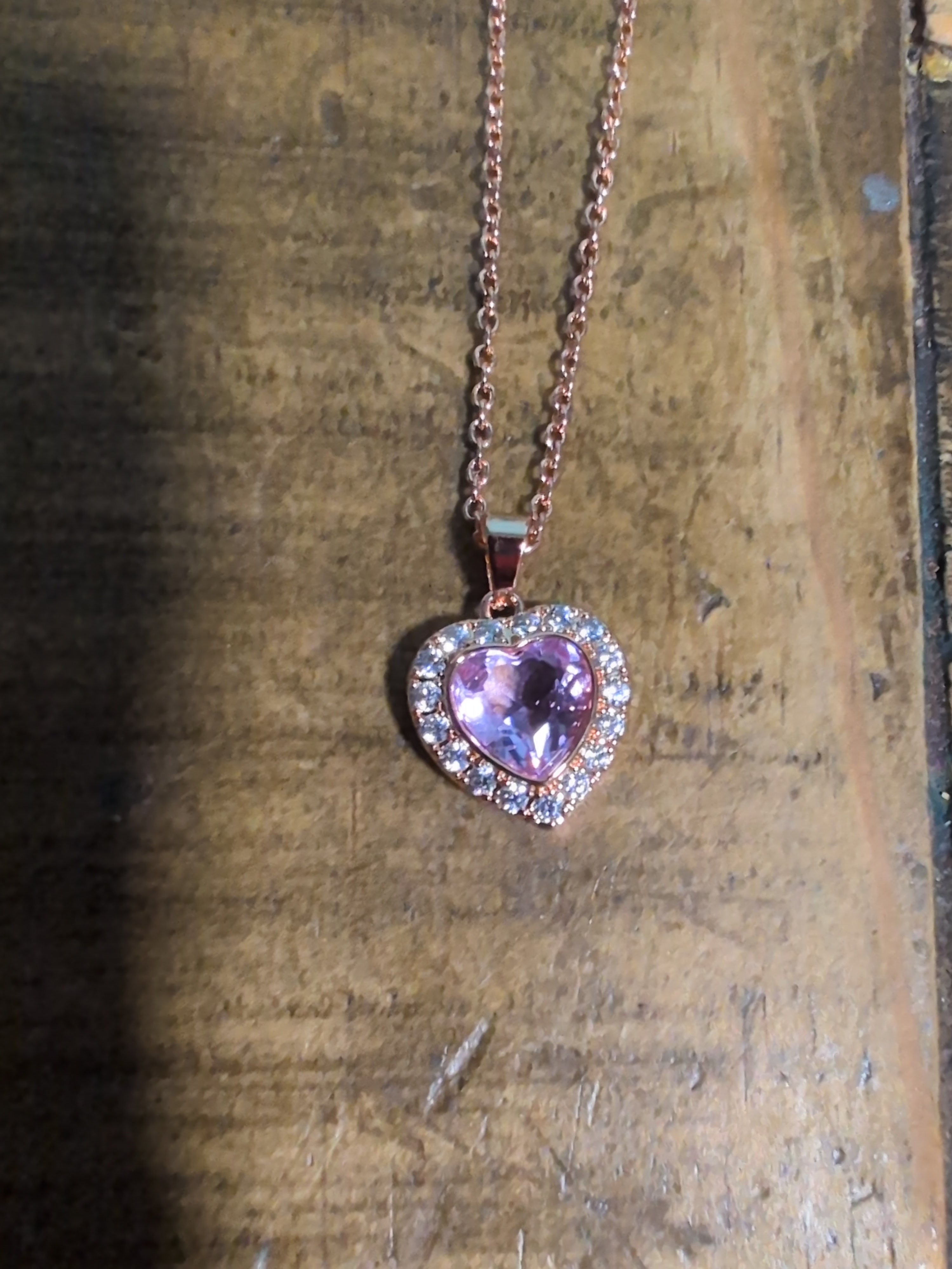 Rose gold necklace with purple gem